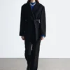 Blazer de lana con cinturón de cuero