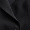 Blazer de lana con cinturón de cuero