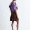Blusa con cuello en V y volantes