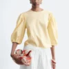 Blusa de jacquard con mangas abullonadas