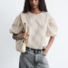 Blusa de jacquard con mangas abullonadas
