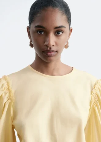 Blusa de jacquard con mangas abullonadas