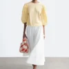 Blusa de jacquard con mangas abullonadas