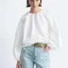 Blusa de popelín de algodón con cremallera frontal