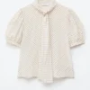 Blusa de seda estampada con cuello lazo