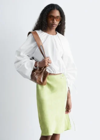 Blusa escultural con cordón