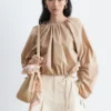 Blusa escultural con cordón