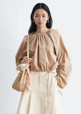 Blusa escultural con cordón