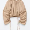Blusa escultural con cordón