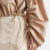 Blusa escultural con cordón