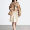 Blusa escultural con cordón