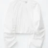 Blusa escultural con cordón