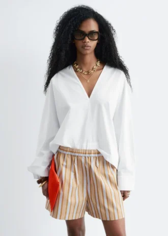 Blusa escultural de algodón con cuello en V