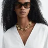 Blusa escultural de algodón con cuello en V