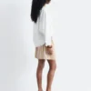 Blusa escultural de algodón con cuello en V