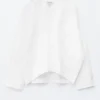 Blusa escultural de algodón con cuello en V