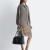 Blusa fruncida con lazo en la espalda