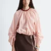 Blusa voluminosa con detalle de lazos