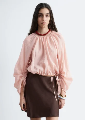 Blusa voluminosa con detalle de lazos
