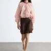Blusa voluminosa con detalle de lazos
