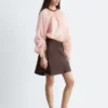 Blusa voluminosa con detalle de lazos