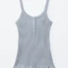 Camiseta sin mangas con dobladillo festoneado