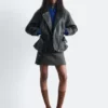 Chaqueta motera de cuero con cinturón