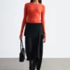 Falda midi cruzada asimétrica