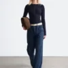 Jersey de lana merina con media tapeta