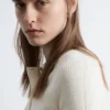 Jersey de lana merina con media tapeta