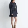 Minifalda de denim plisada
