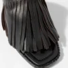 Mules de cuero con flecos