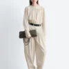 Pantalones acampanados con pliegues