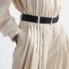 Pantalones acampanados con pliegues