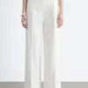 Pantalones de algodón con pliegues marcados