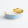 Pulsera tipo brazalete en dos tonos