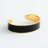 Pulsera tipo brazalete en dos tonos
