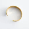 Pulsera tipo brazalete en dos tonos