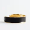 Pulsera tipo brazalete en dos tonos