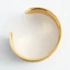Pulsera tipo brazalete en dos tonos