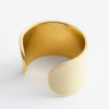 Pulsera tipo brazalete en dos tonos