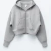 Sudadera corta con capucha y cremallera de neopreno