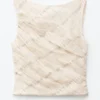 Top con cuello barco texturizado