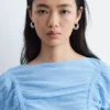 Top con mangas casquillo y fruncidos