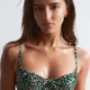 Top de bikini con aros y detalle de lazo