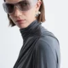 Top de cuello alto drapeado