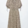 Vestido midi con lazo en la cintura