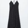 Vestido midi liso con lunares
