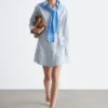 Vestido mini tipo camisa cruzada