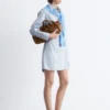 Vestido mini tipo camisa cruzada